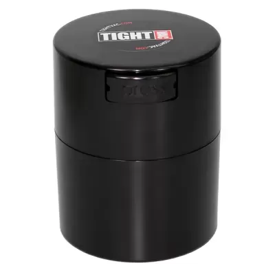 Frasco cilíndrico preto com tampa e etiqueta 'TIGHT'