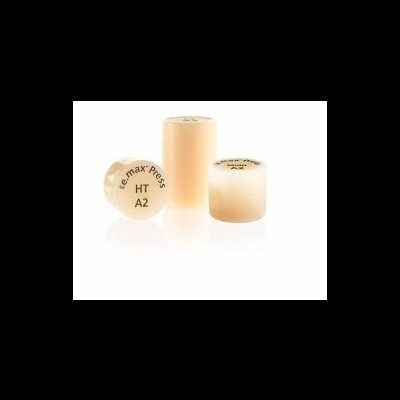 Três blocos cerâmicos bege, um com inscrição e.max press HT A2, em fundo branco