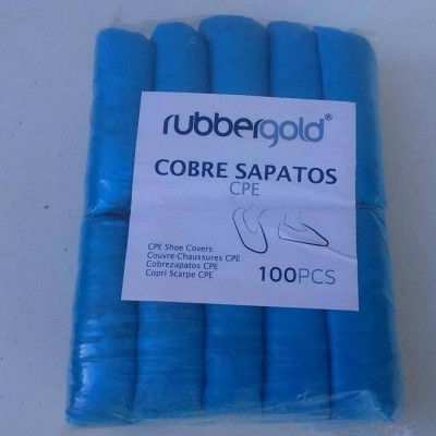 Pacote azul de cobre sapatos Rubbergoldd com etiqueta branca