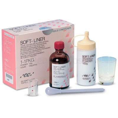 Produto SOFT-LINER com caixa, frascos branco e marrom, colher e copo de vidro para aplicação.