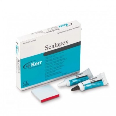 Caixa do Sealapex da Kerr com dois tubos pequenos e uma espátula branca com borda vermelha