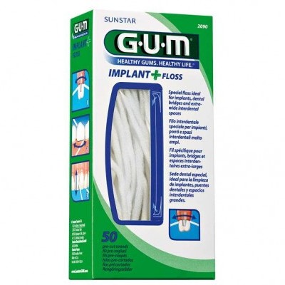 Caixa de fio dental GUM IMPLANT + FLOSS, verde e branca, com janela mostrando o fio dental branco enrolado.