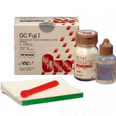 Produto dentário GC Fuji I com embalagem, frascos, espátula vermelha e bandeja para mistura