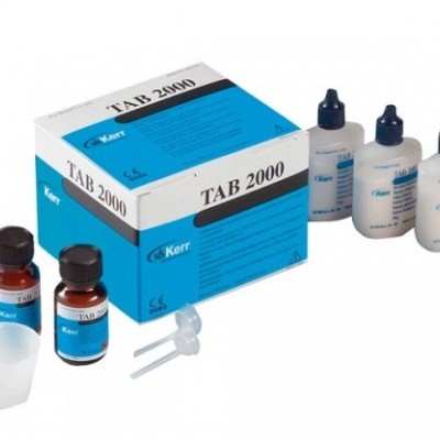 Kit com caixa TAB 2000 e frascos de produtos dentários Kerr.