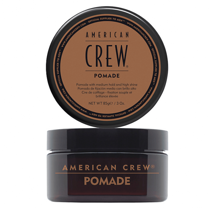 Frasco de pomada American Crew castanho com tampa preta e texto em castanho e preto