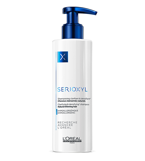 Frasco de champô branco e azul L'Oréal Serioxyl