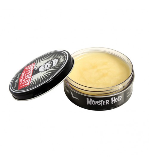 Pomada para cabelo Suavecito Monster Hold em embalagem preta aberta com conteúdo amarelo visível