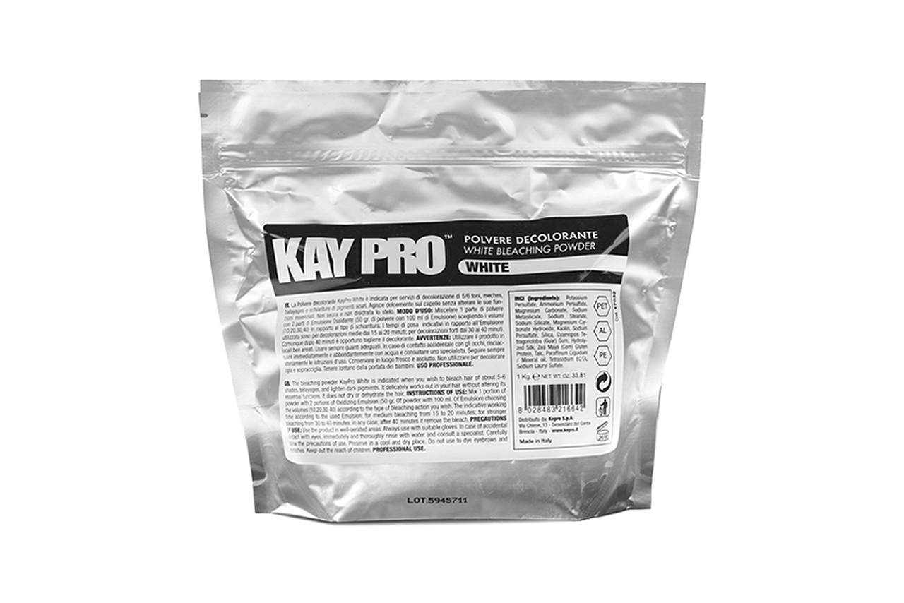 Embalagem prata de pó descolorante Kay Pro White com texto preto e branco