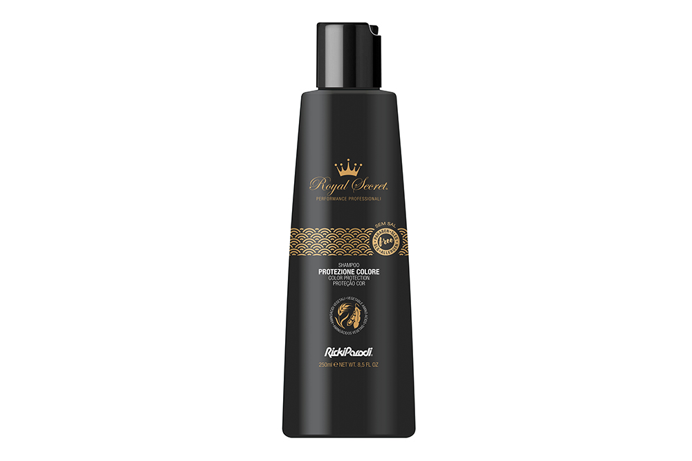 Frasco preto de shampoo Royal Secret com texto dourado e branco