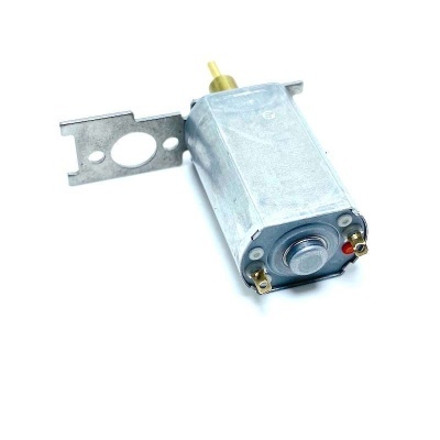 Motor elétrico metálico com suporte e terminais numa superfície branca