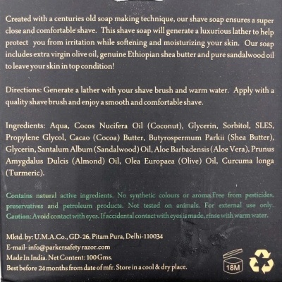 Embalagem de sabonete de barbear com lista de ingredientes e instruções em inglês, fundo preto e texto branco e verde.