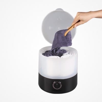 Máquina elétrica de vapor para toalhas com toalhas dentro