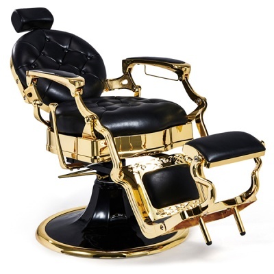 cadeira de barbeiro dourada com estofos pretos e base preta