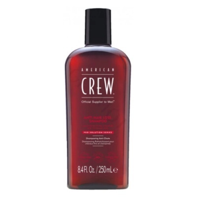 Frasco vermelho de champô American Crew com tampa preta