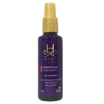 Frasco roxo com spray amarelo dourado de colónia para animais