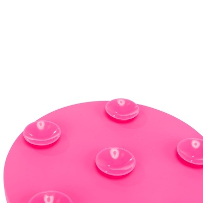 Objeto circular cor-de-rosa com ventosas transparentes