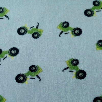 Pélucia Coralina Dupla Face com tratores