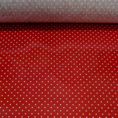 Plastificado com pintinhas brancas em fundo vermelho