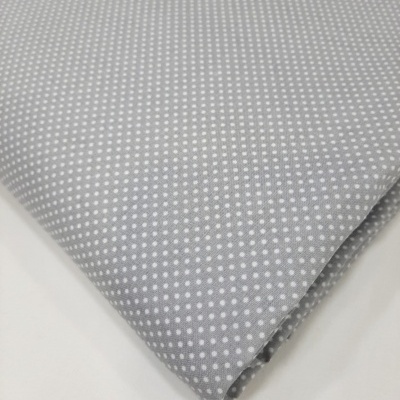 Pintinhas brancas em fundo cinza