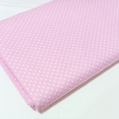 Flanela com bolinhas brancas em fundo rosa