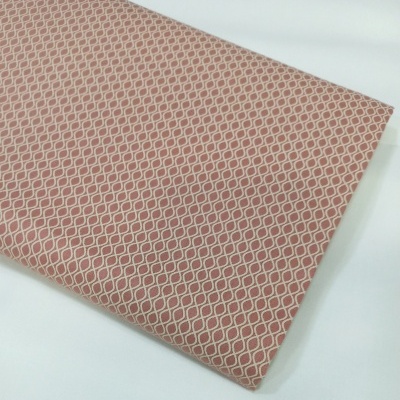 Geométrico com ondinhas beges em fundo salmão escuro