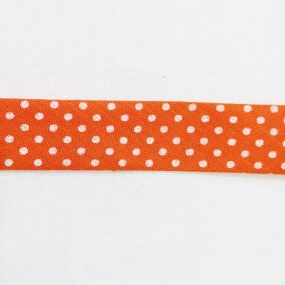 viés com pintinhas brancas em fundo laranja