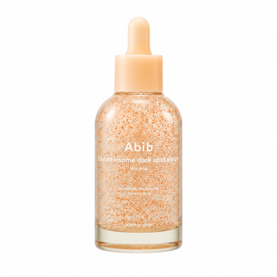 Frasco de sérum Abib com partículas laranjas e conta-gotas cor bege