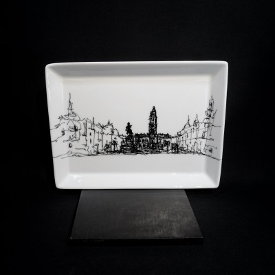 prato retangular branco com desenho urbano preto sobre base preta