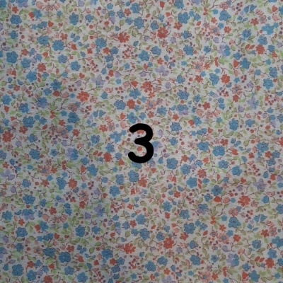 Tecido floral colorido com número 3 preto no centro