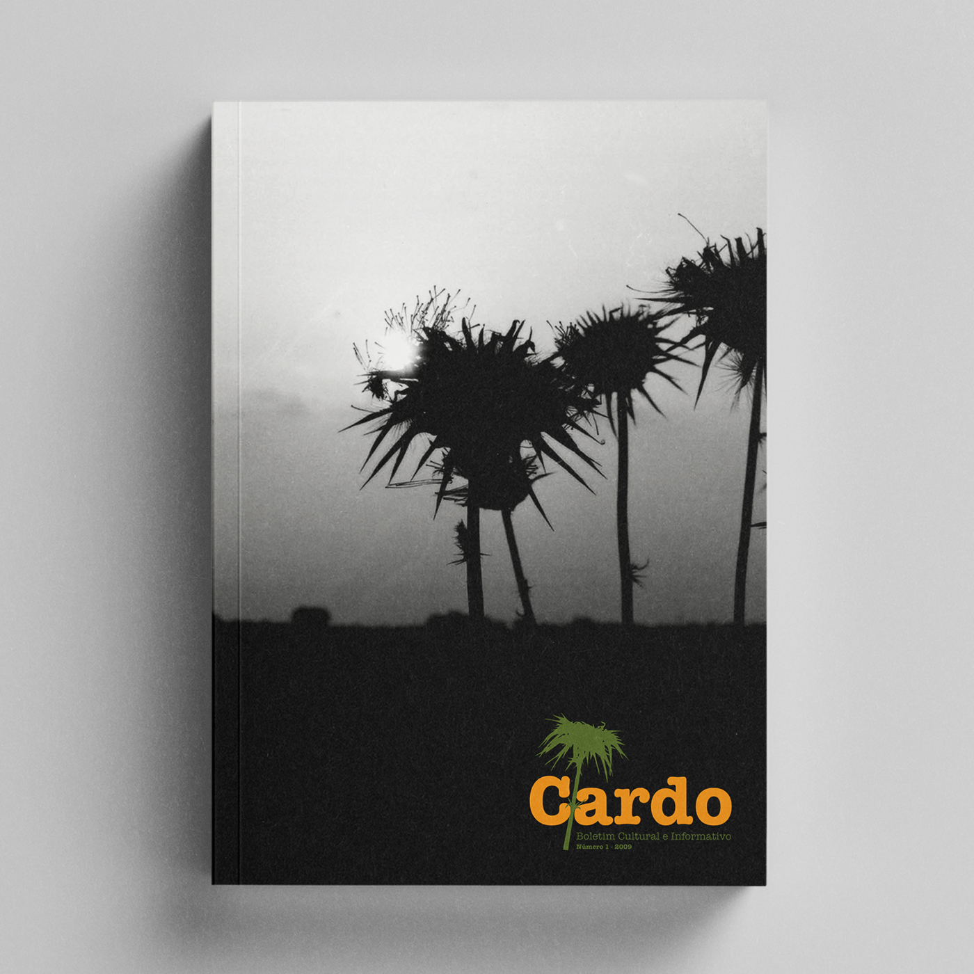Cardo Livro com capa preta e branca a mostrar cardos em silhueta e título Cardo em laranja.