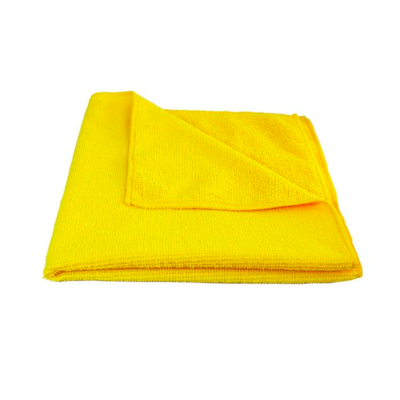 Pano ou toalha amarelo dobrado em fundo branco