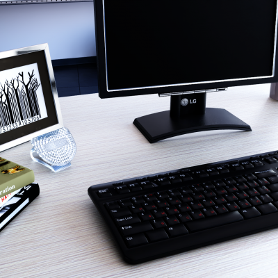 Secretária com teclado, monitor, porta-retratos, copo de vidro, livros e material de escritório colorido