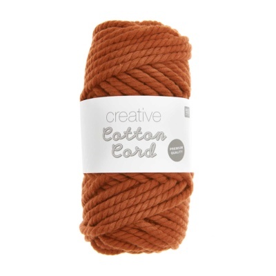 Novelo de lã grossa terracota com etiqueta branca