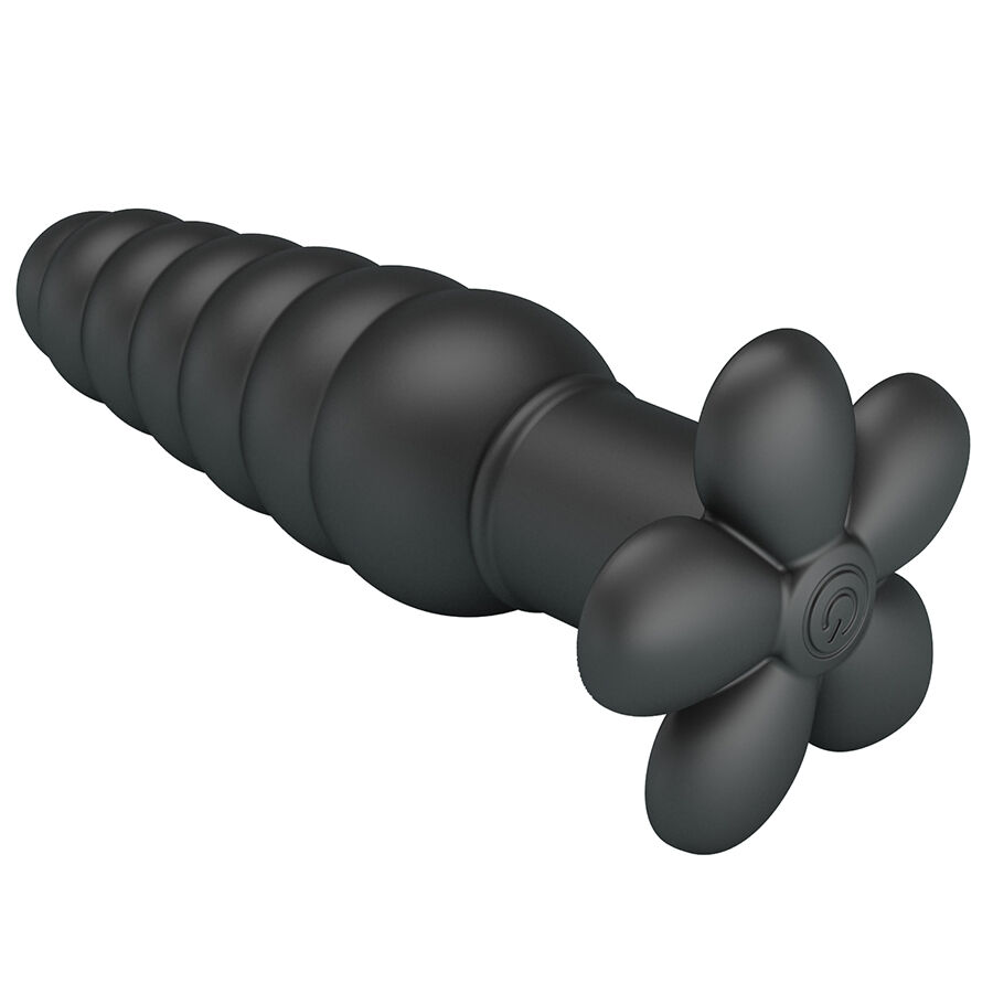 Objeto preto com segmentos arredondados e ponta em forma de flor preta.