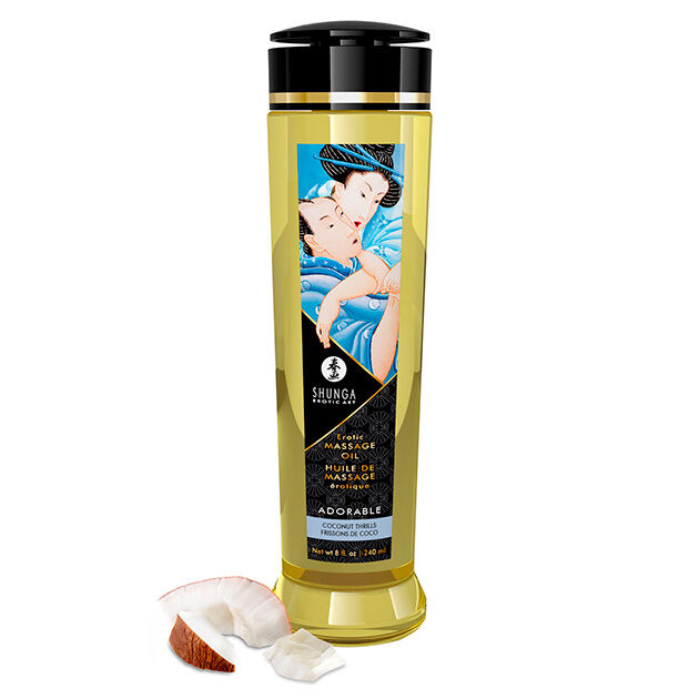 Frasco dourado de óleo de massagem com rótulo ilustrado e pedaços de coco.
