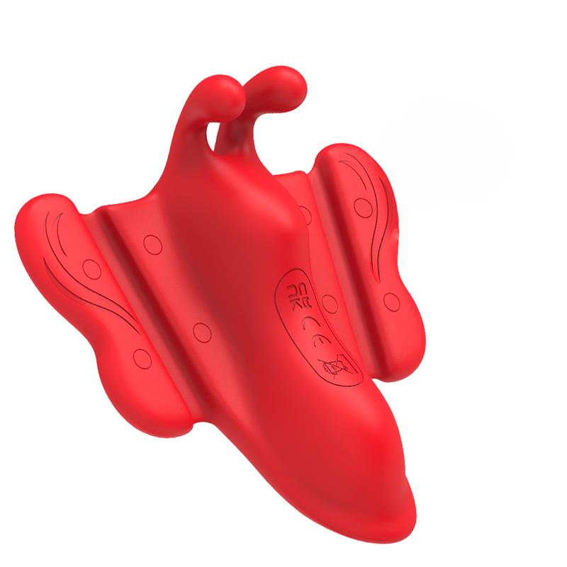 Brinquedo plástico vermelho com asas decorativas e marcações CE