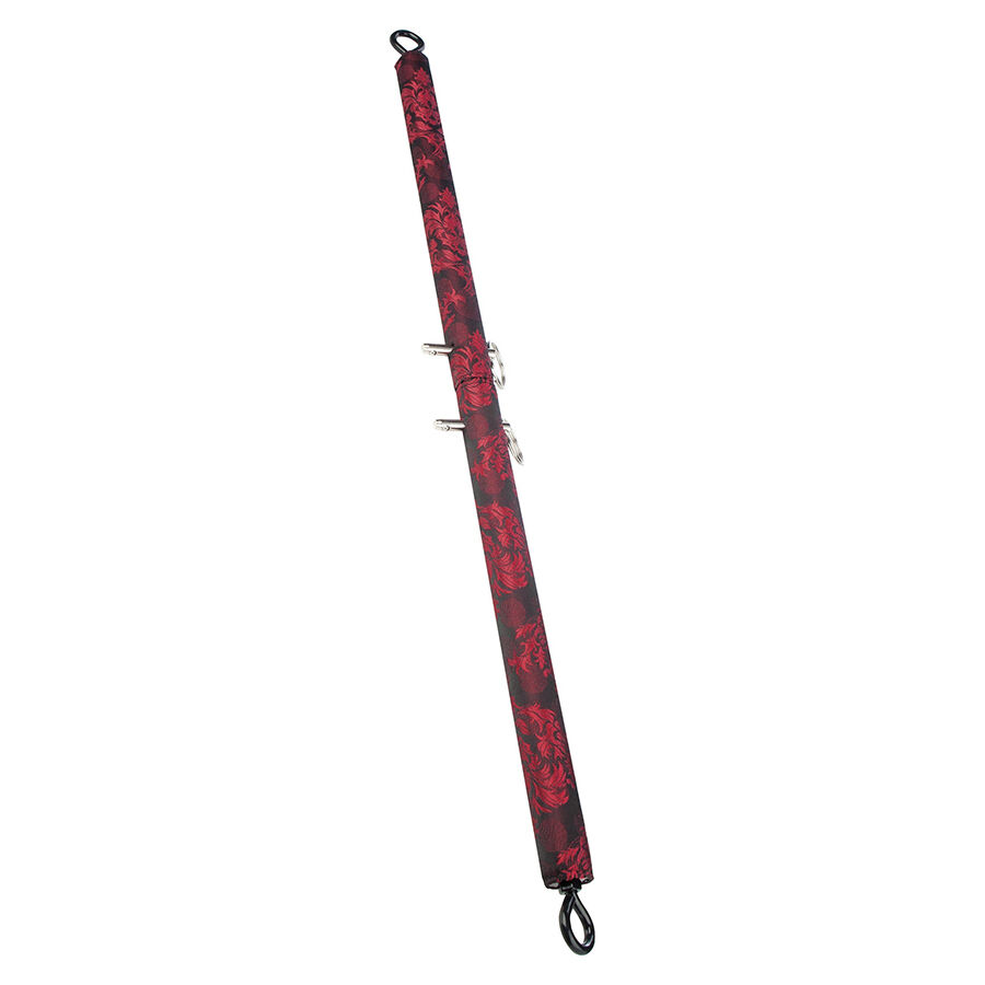 Braçadeira longa de padrão floral vermelho e preto com detalhes metálicos e argolas.
