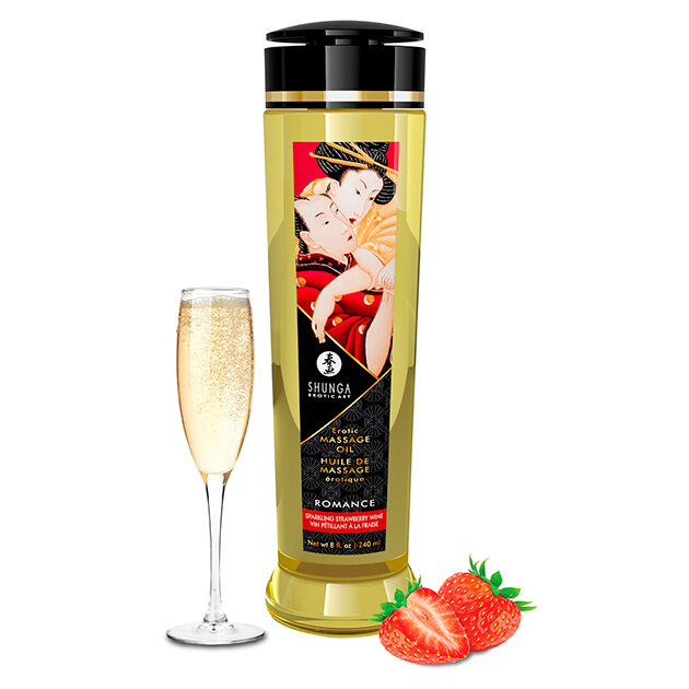 Frasco de óleo de massagem dourado com etiqueta colorida, copo de champanhe e morangos.