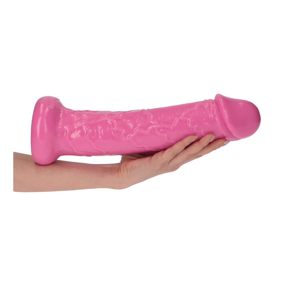 Dildo rosa grande com textura segurado por uma mão