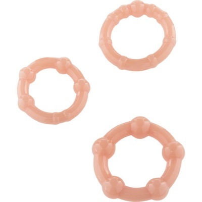 Três anéis de plástico rosa com textura irregular