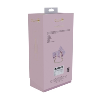 Embalagem rosa de algemas com laços cor-de-rosa e corrente dourada