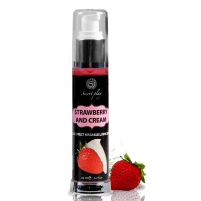 Frasco de lubrificante beijável morango e creme com um morango ao lado