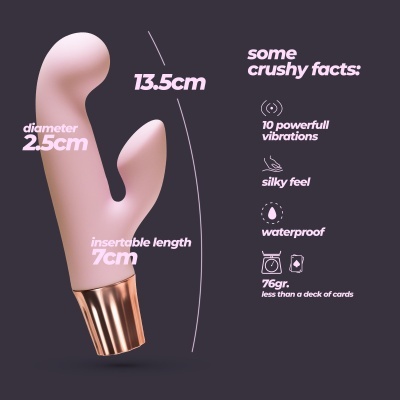 Vibrador rosa claro com cabo dourado e texto informativo sobre suas dimensões e características