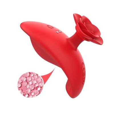 Dispositivo vermelho ergonómico com flor na extremidade e símbolos CE e reciclagem