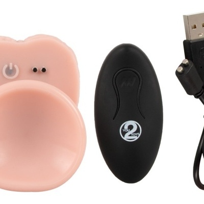 Dispositivo de silicone cor de pele, comando preto com texto e cabo USB preto