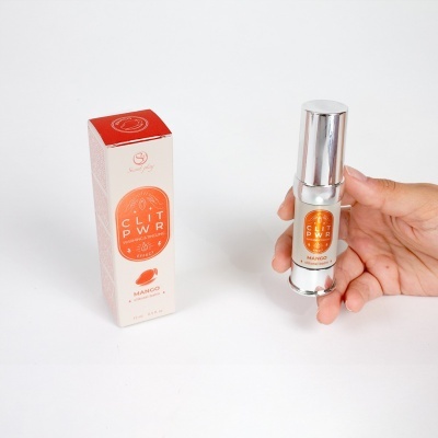 Bálsamo clitoriano Clit Pwr sabor manga com embalagem e frasco prateado