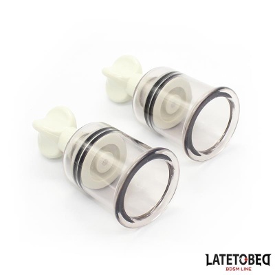Duas ventosas transparentes com manípulo branco e anéis pretos
