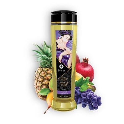 Frasco de óleo de massagem erótico Shunga com frutas variadas ao fundo