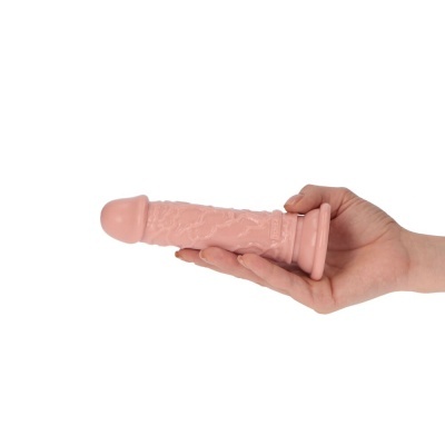 Dildo rosa com textura realista segurado por mão