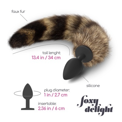Plug anal preto em silicone com cauda de pelúcia castanha e preta, de 34 cm e diâmetro de 2.7 cm.